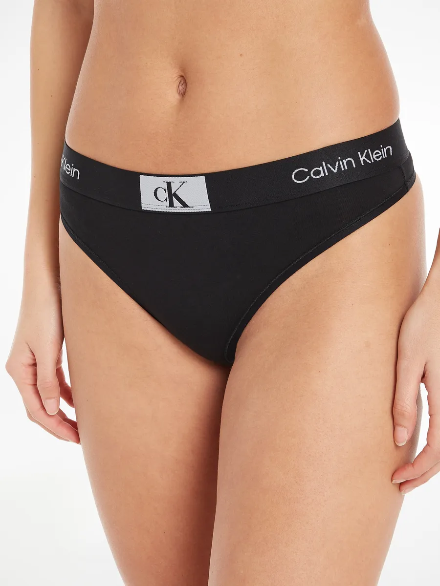 

Calvin Klein Underwear String "MODERN THONG", с принтом по всей поверхности, черный