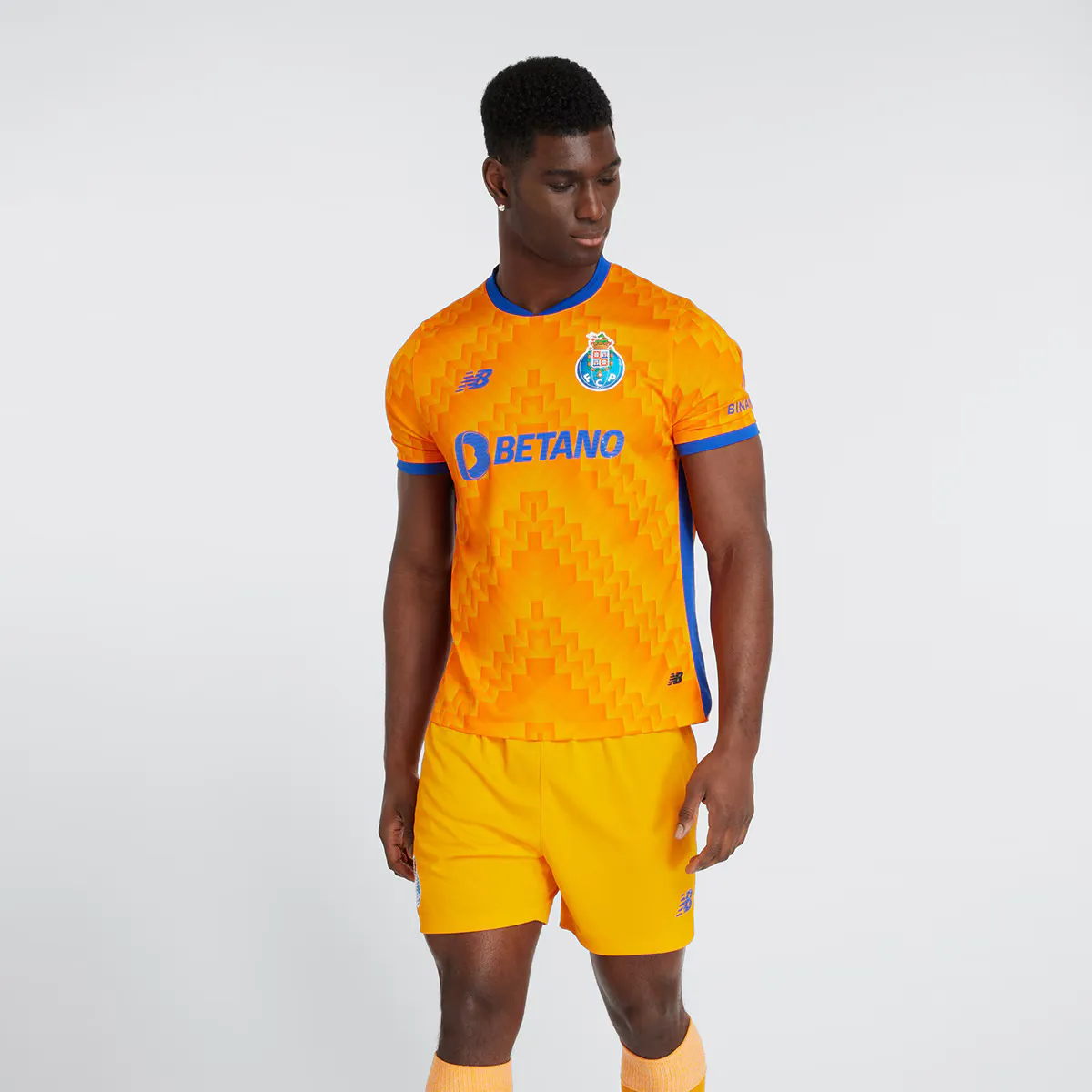 

FC Porto 2024-2025 Реплика New Balance Мужская выездная футболка, оранжевый/темно-синий