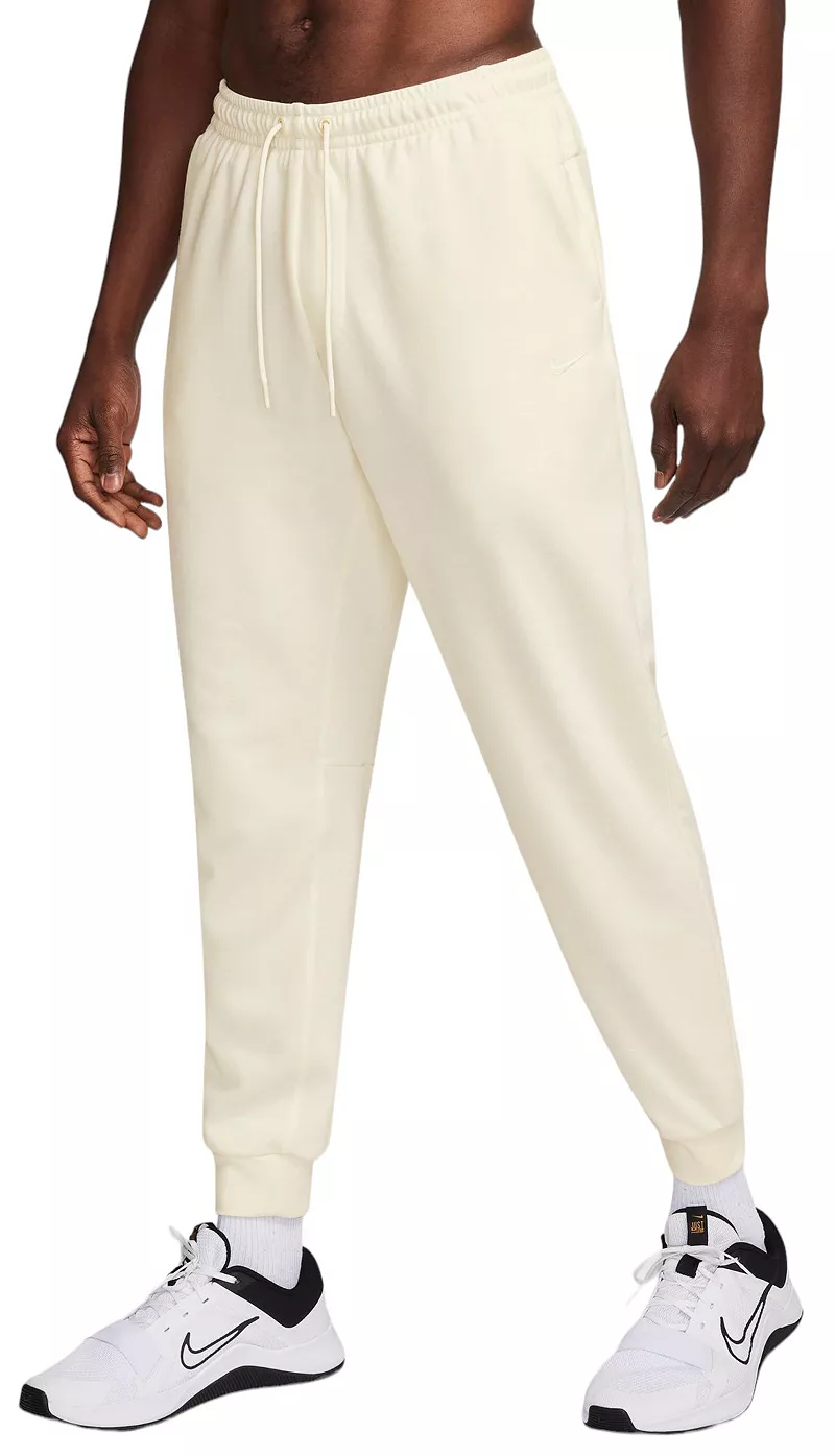 

Мужские джоггеры из флиса с защитой от ультрафиолета Nike Dri-FIT, цвет Pale Ivory