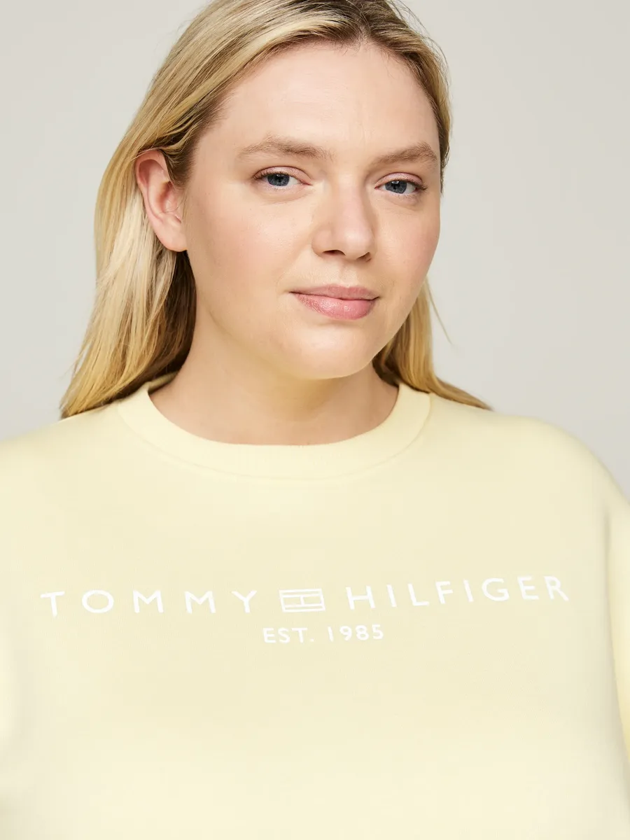 

Толстовка Tommy Hilfiger Curve "CRV MDRN REG CORP LOGO SWTSHRT" с вышитым логотипом, цвет Lemon Zest