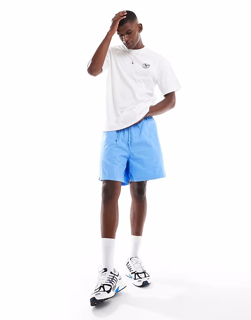 

Тканые шорты Nike Club синего цвета