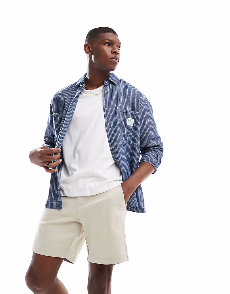 

Узкие шорты-бермуды средней длины ASOS DESIGN цвета «песок»