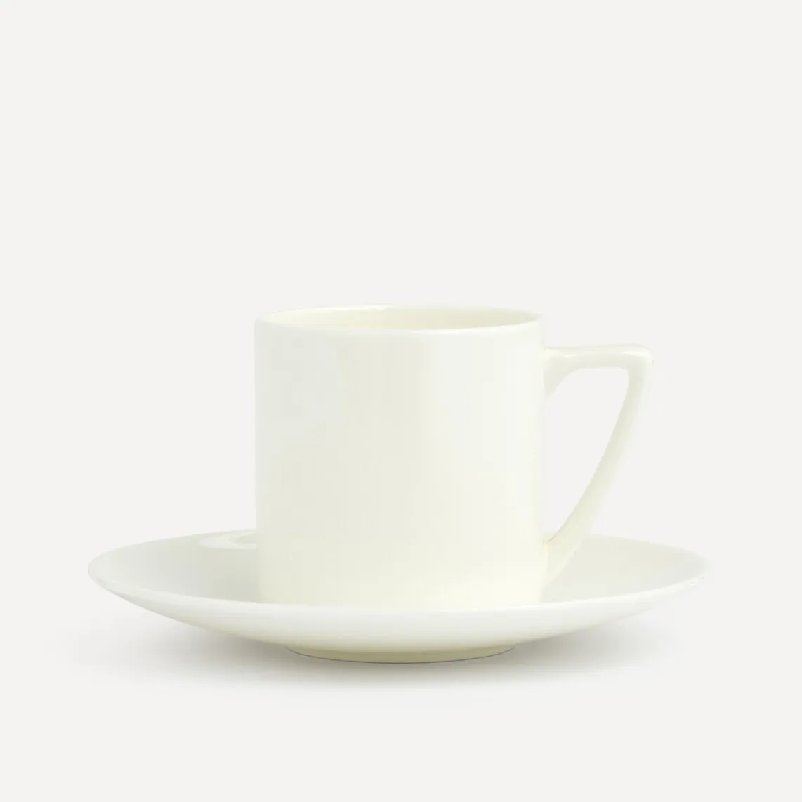 

Чайная чашка с круглым блюдцем и крылышком Bone China Essential El Corte Inglés, белый