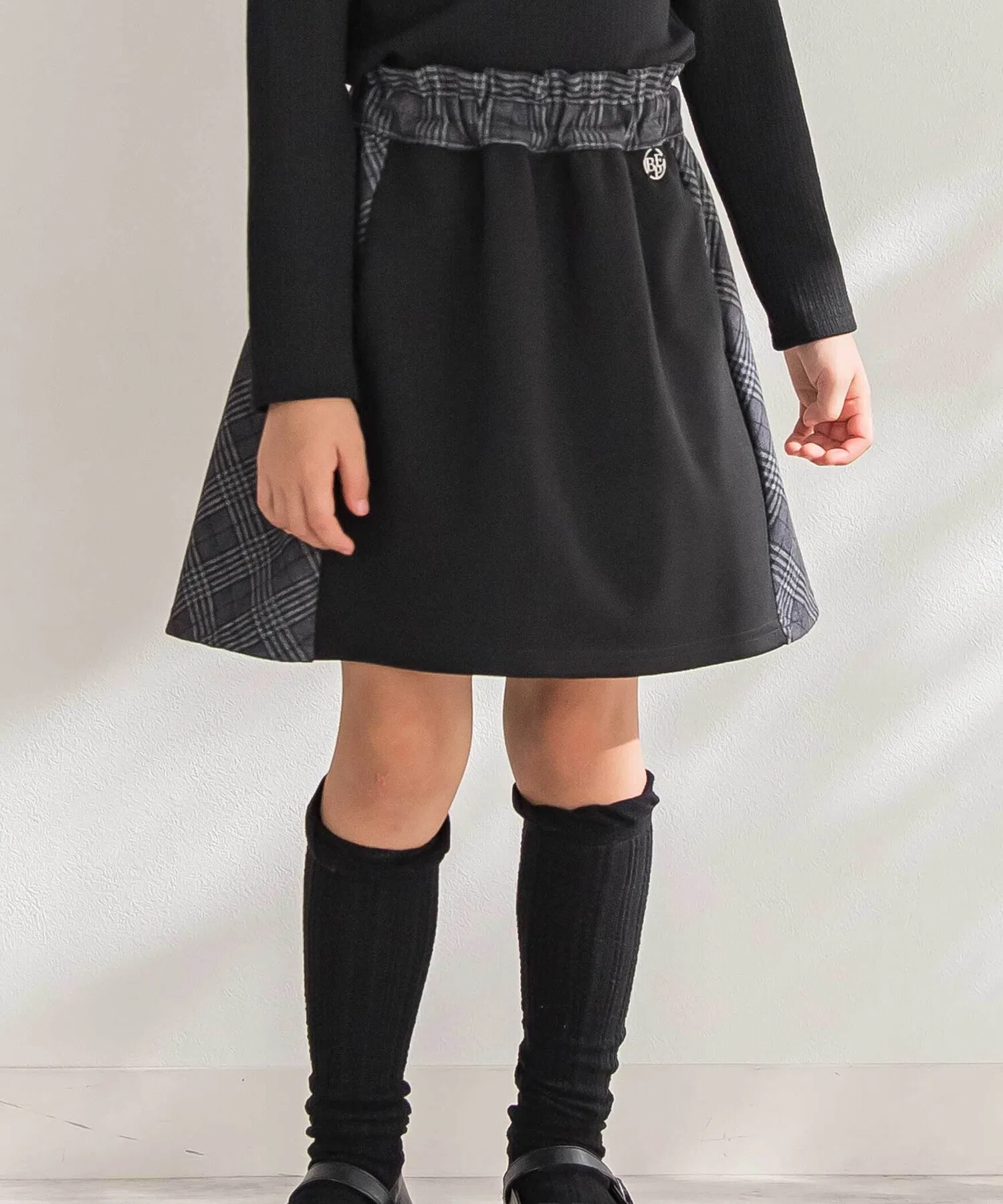 Детская юбка BeBe Petits Pois Vert в клетку с контрастной вставкой чёрная