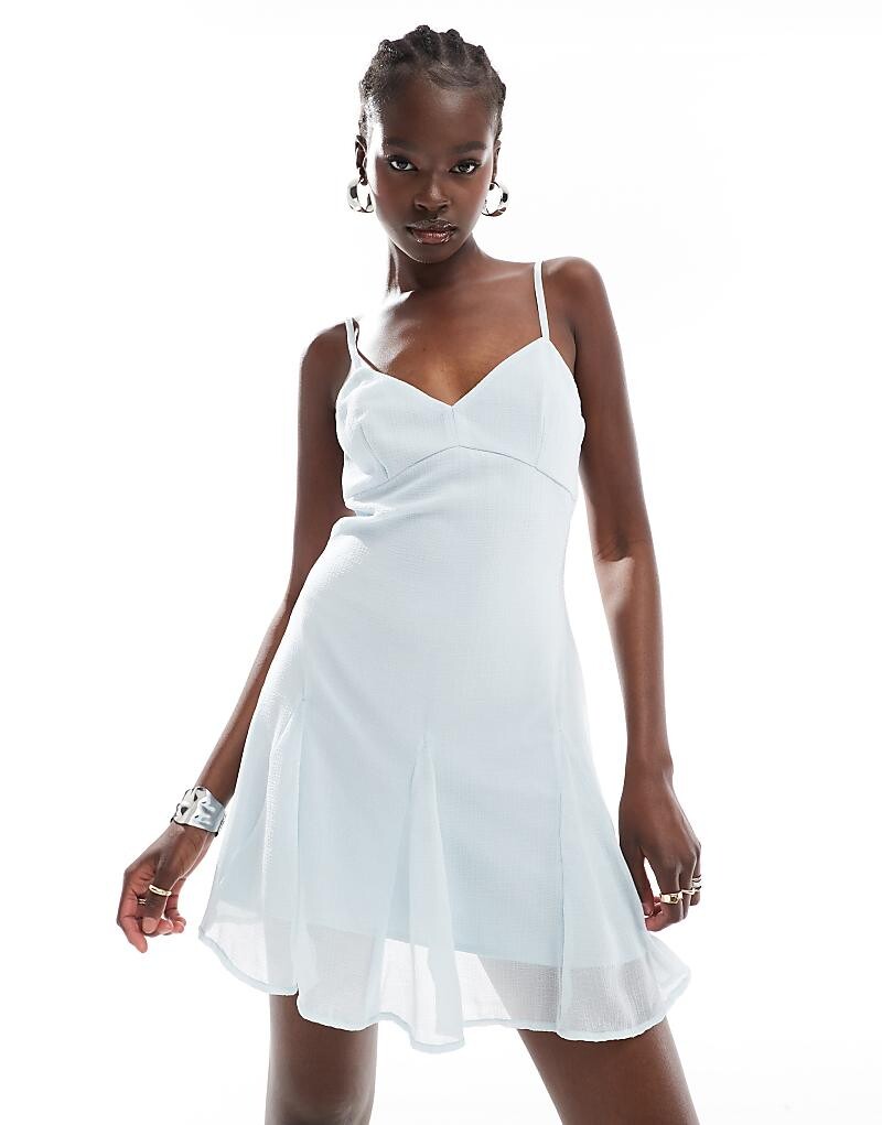 

ASOS DESIGN – Голубое ледяное платье мини на бретелях Swing со складками в виде годе по подолу