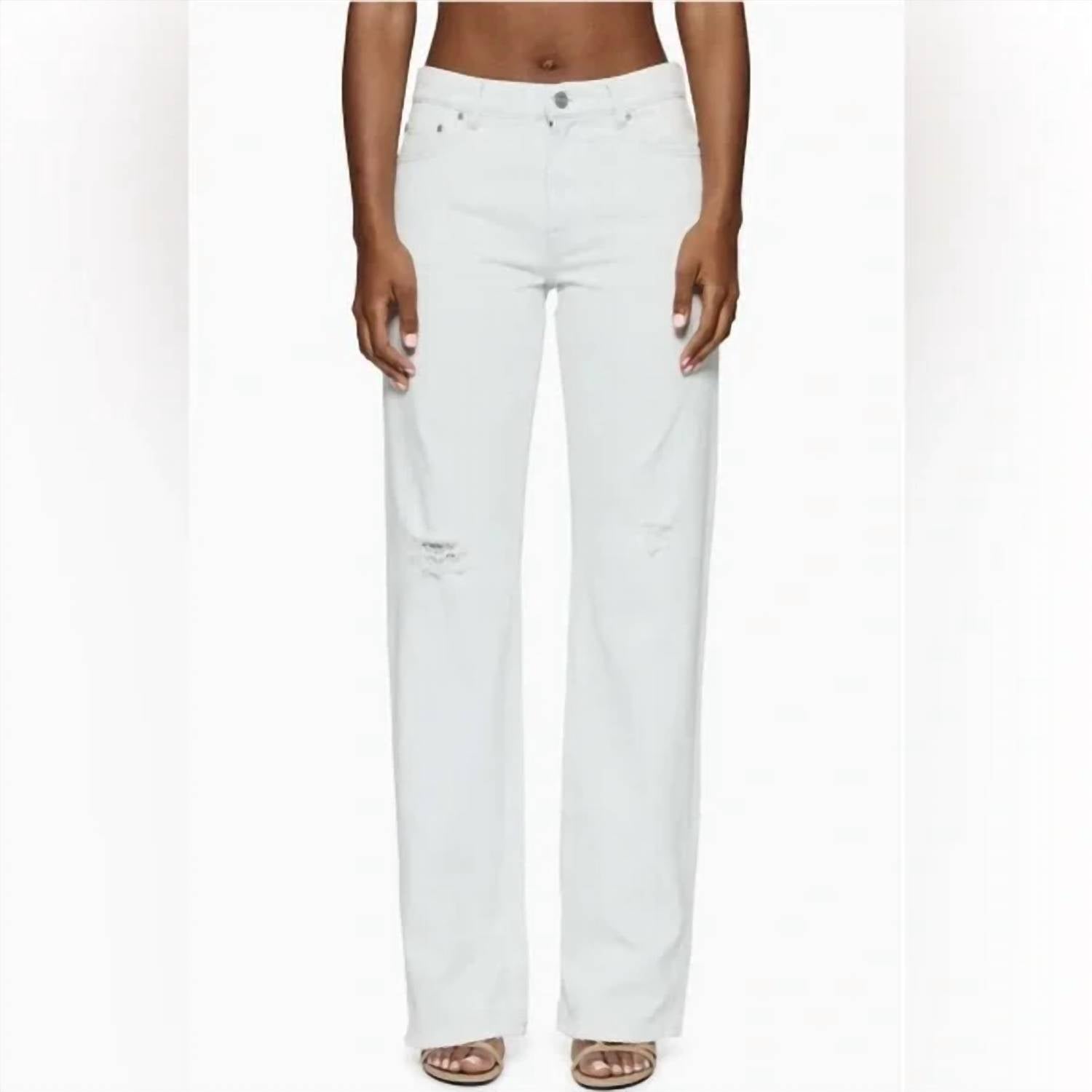 

Женские рваные узкие джинсы прямого кроя в белом оттенке с голубым подтоном Purple Brand