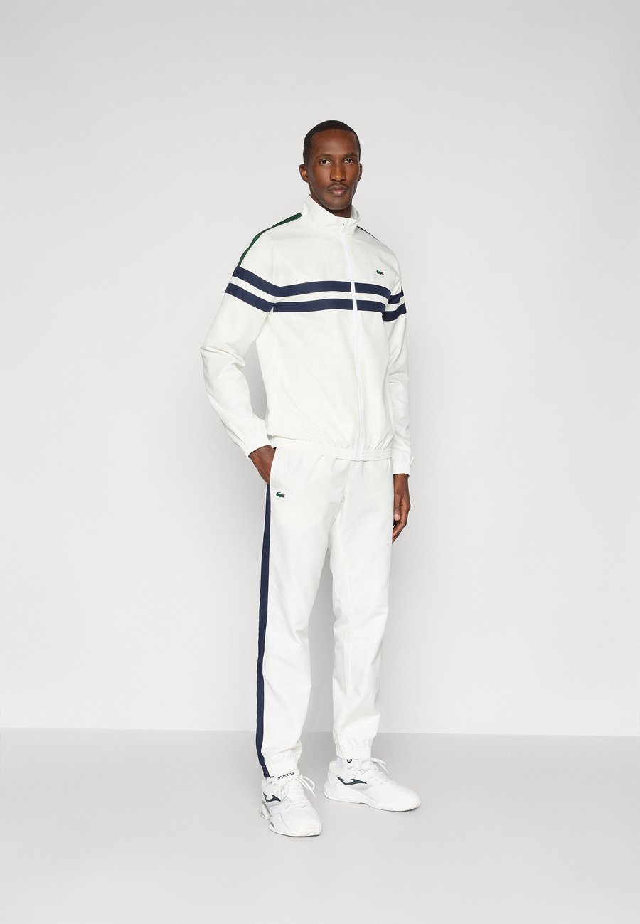 

Спортивный костюм Lacoste Sport TENNIS TRACKSUIT SET, Flour/Navy Blue/Green/Off-White