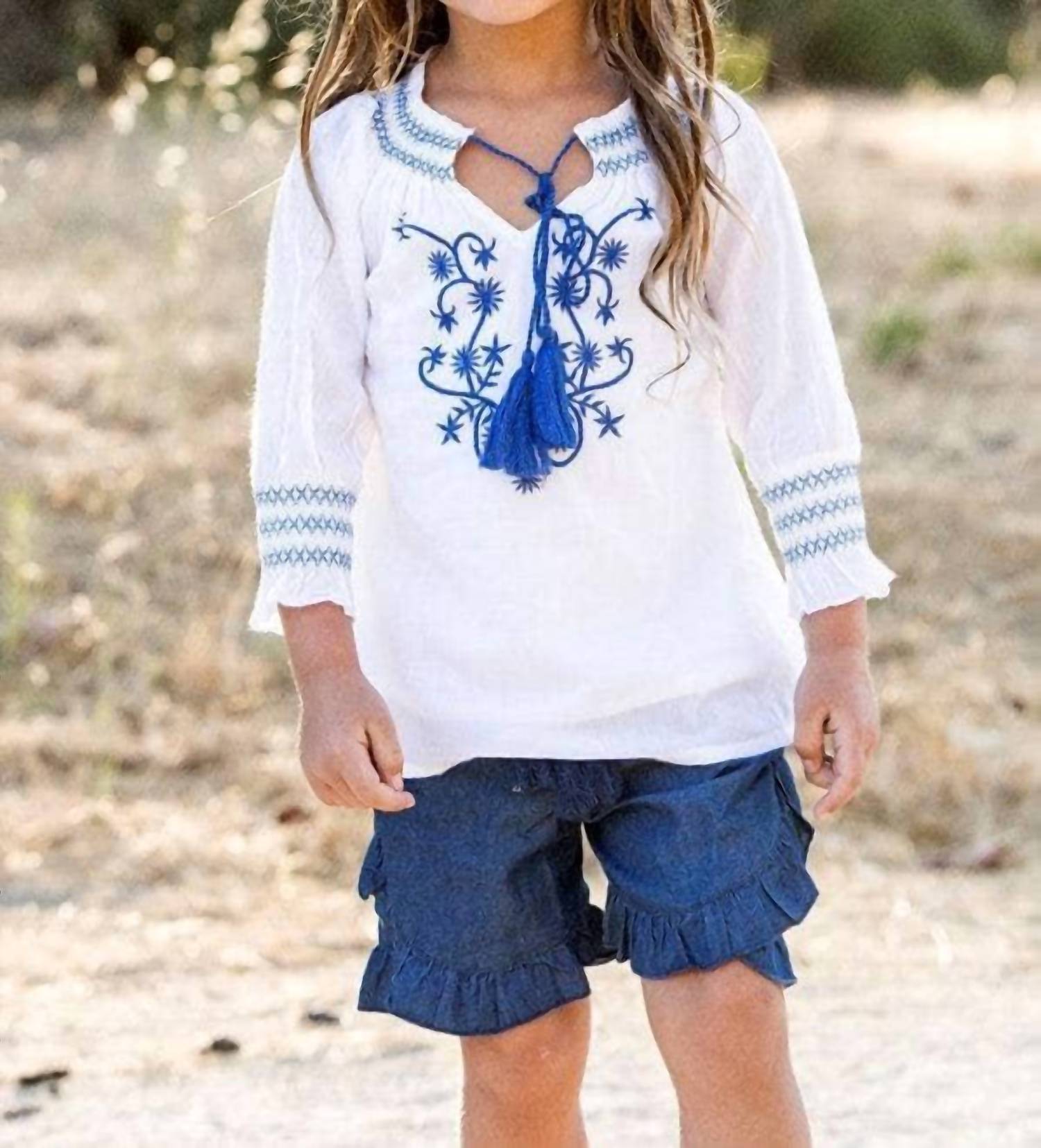 

Оригинальная туника с кисточками в бело-голубой гамме Guadalupe Design