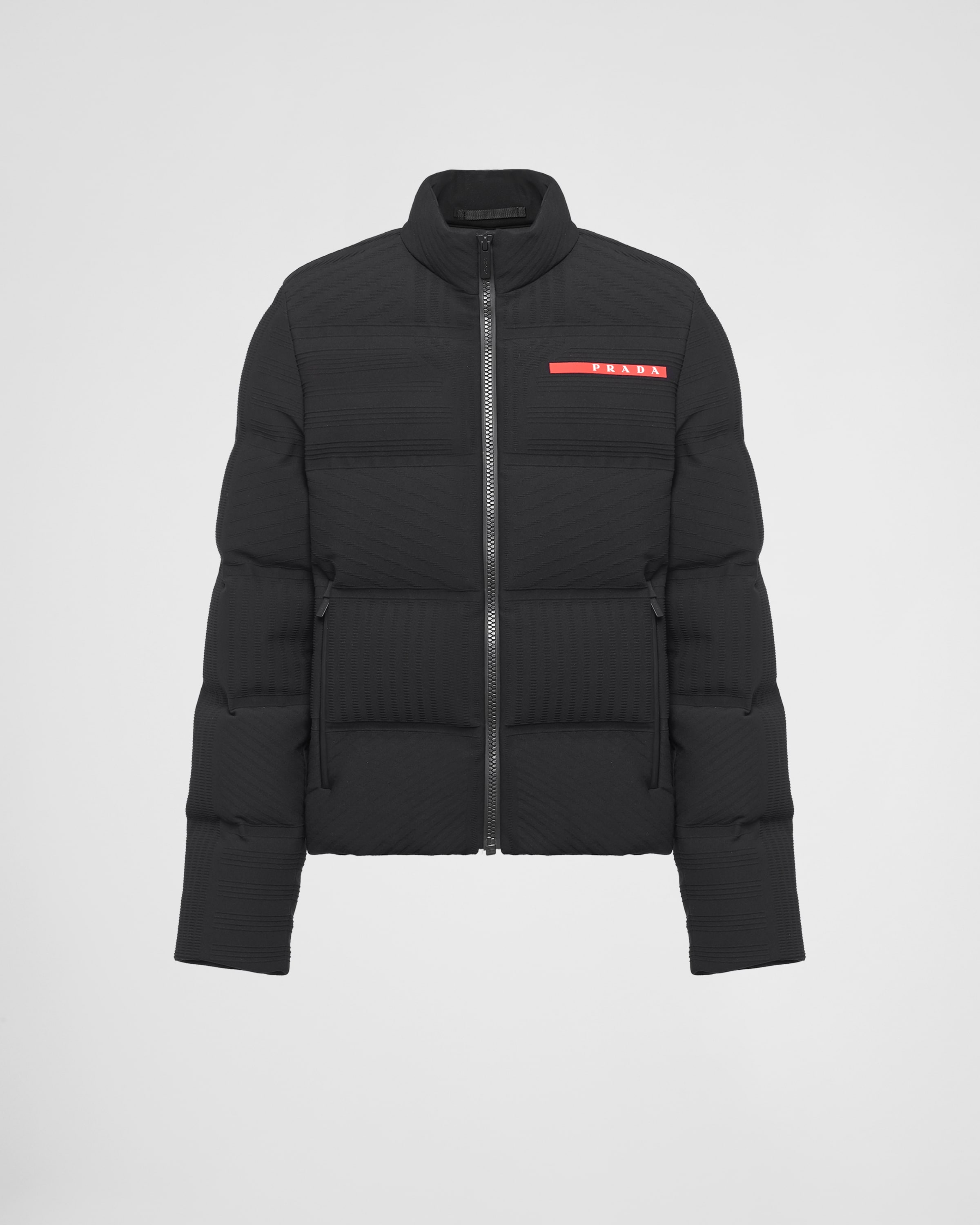 

Укороченная пуховая куртка из технического трикотажа Prada, черный