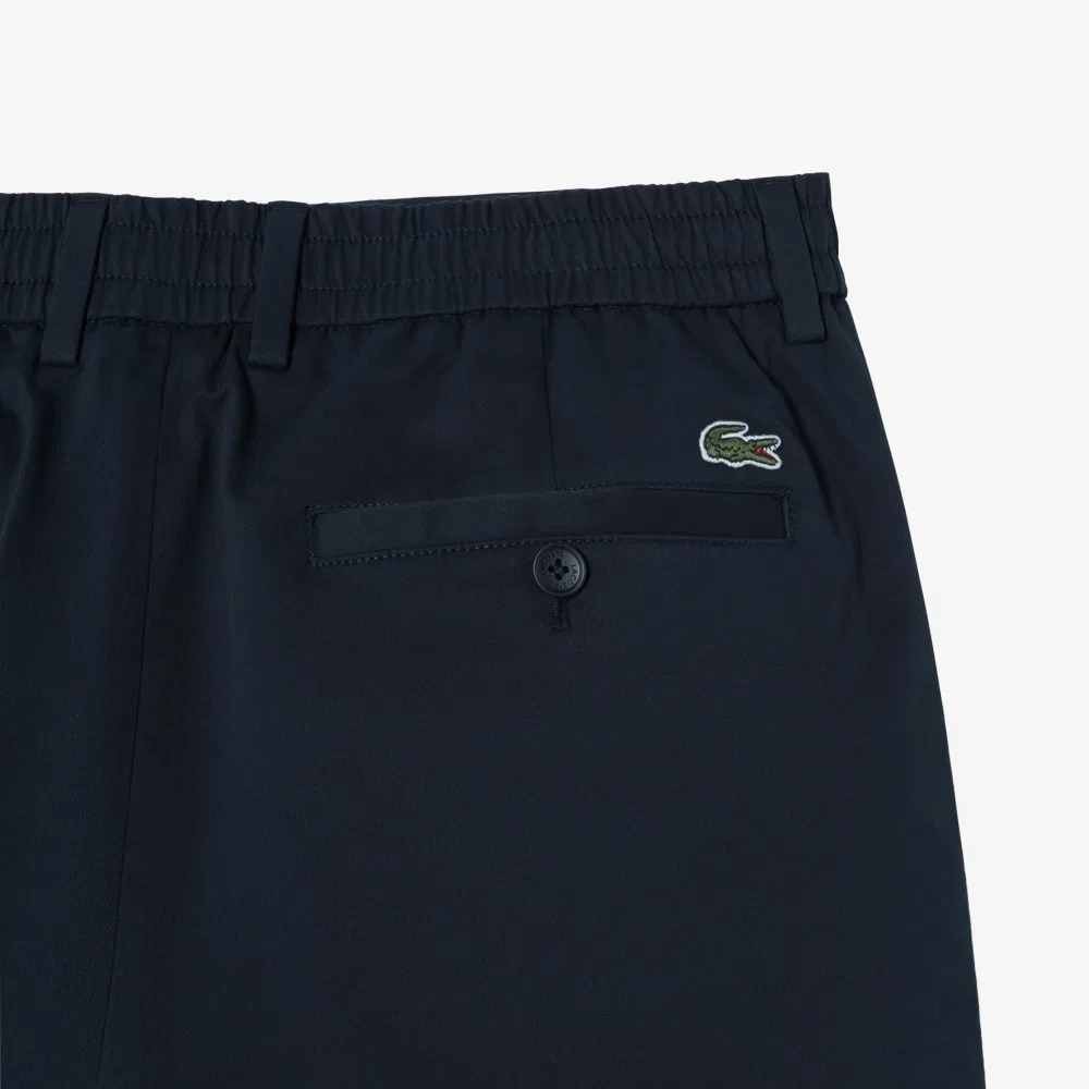 Мужские бермуды чинос из хлопка и полиуретана тёмно-синего цвета от Lacoste — фото 3