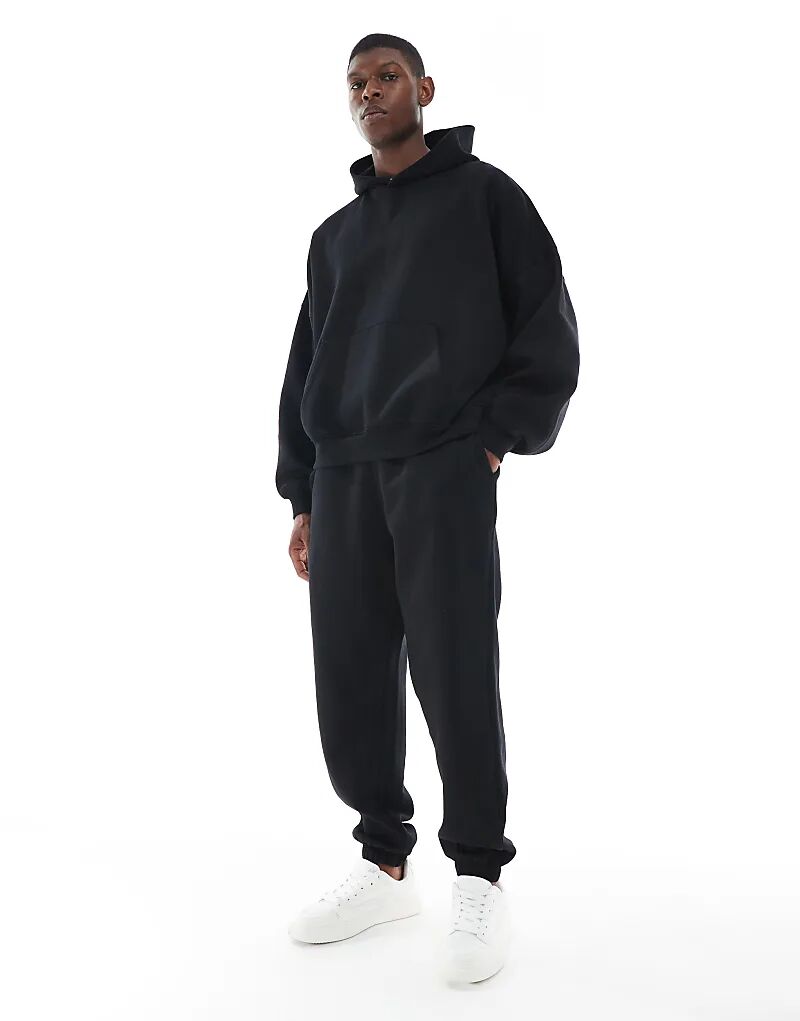 

Базовые свободные спортивные брюки ASOS DESIGN черного цвета
